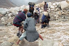 23 Ali And Naqi Help Porters Cross The Swollen River Descending From Paiju Glacier.jpg